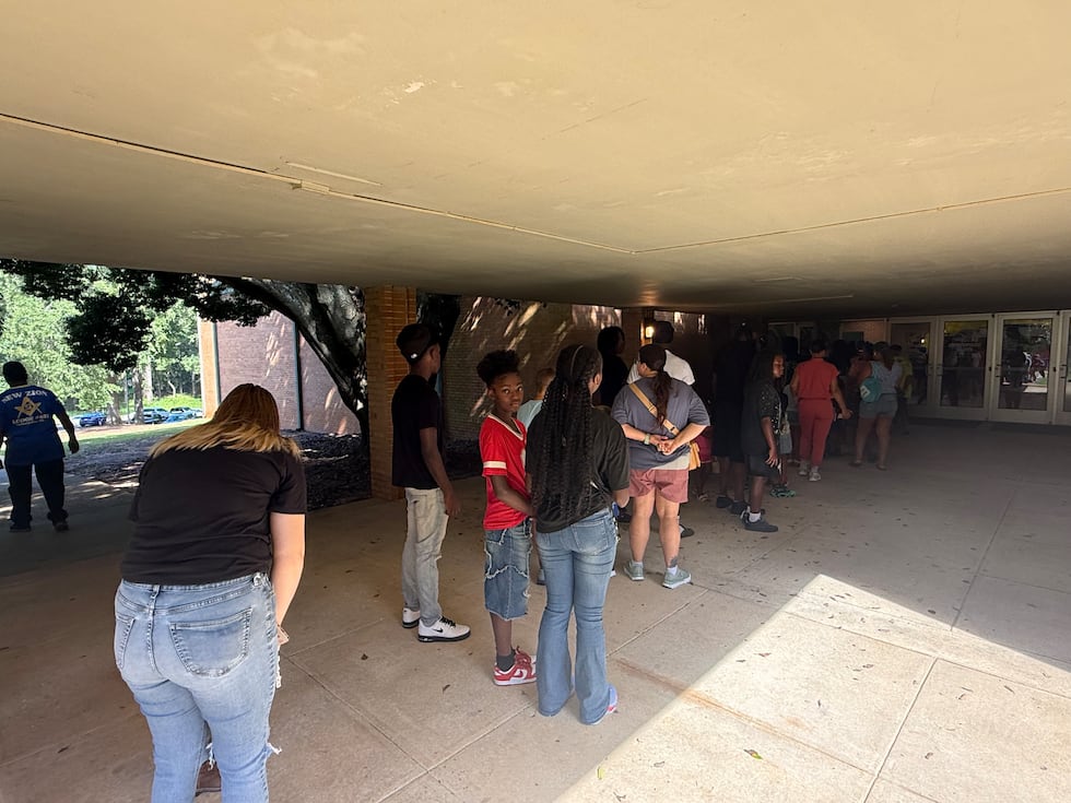 A long line stretched out the doors and wrapped around the building Saturday at Enterprise...