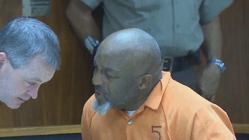 Pastor Kenneth Glasgow (R) confers with his attorney, Derek Yarbrough, in this 2018 photo.