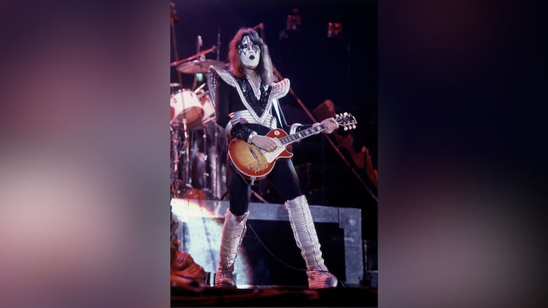 FILE - Ace Frehley, lead guitarist for the hard-rock glam band KISS, performs with a Les Paul...
