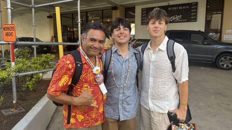 Two band members on a patriotic trip to Hawaii, Mason Crawford (center) and Griffin Johnson...